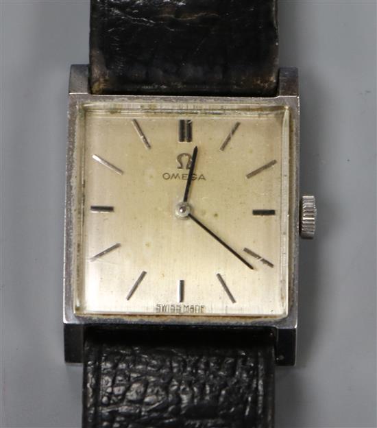 A ladys stainless steel Omega square dial manual wind wrist watch.